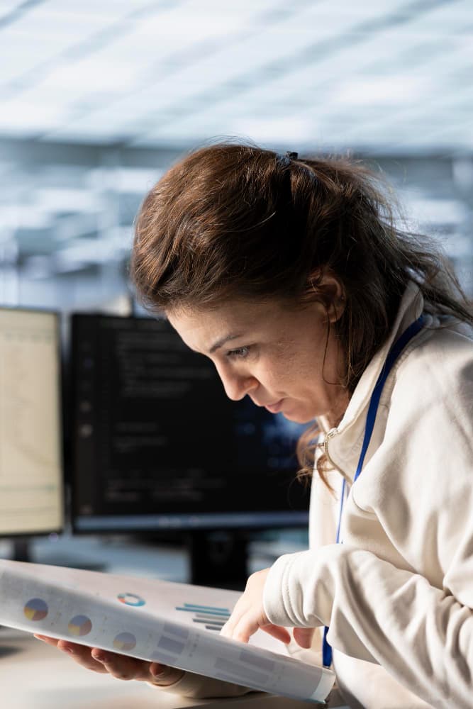 Professional working with technology to address challenges